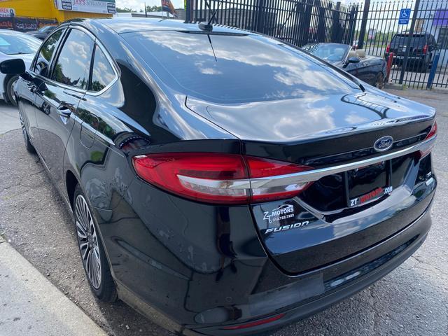 used 2018 Ford Fusion car, priced at $11,700