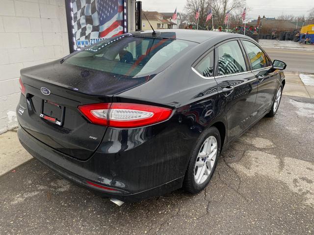 used 2015 Ford Fusion car, priced at $5,700