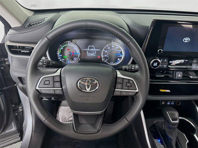 used 2025 Toyota Highlander Hybrid car, priced at $52,995