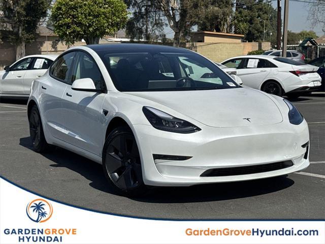 used 2023 Tesla Model 3 car, priced at $26,140