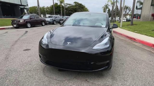 used 2025 Tesla Model Y car, priced at $42,600