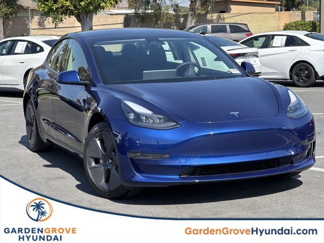 used 2023 Tesla Model 3 car, priced at $26,630