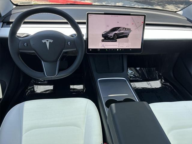 used 2023 Tesla Model 3 car, priced at $27,700