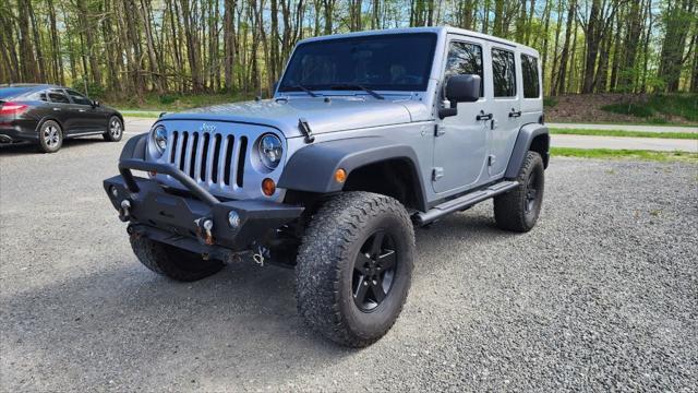 used 2013 Jeep Wrangler Unlimited car, priced at $15,495