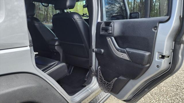 used 2013 Jeep Wrangler Unlimited car, priced at $15,495