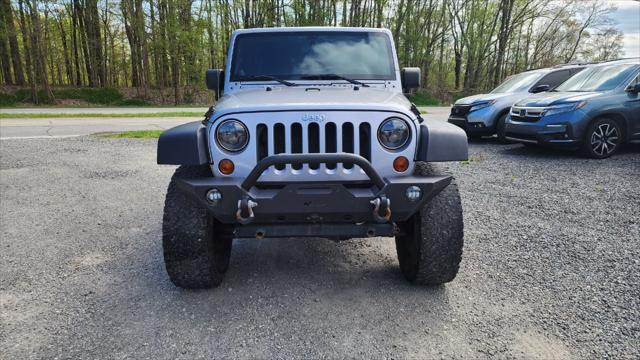 used 2013 Jeep Wrangler Unlimited car, priced at $15,495