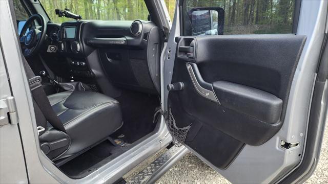 used 2013 Jeep Wrangler Unlimited car, priced at $15,495