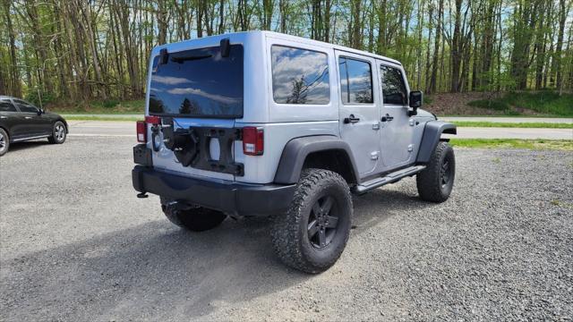 used 2013 Jeep Wrangler Unlimited car, priced at $15,495