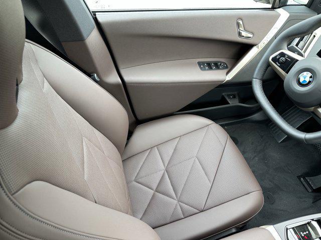 new 2026 BMW iX car, priced at $83,025