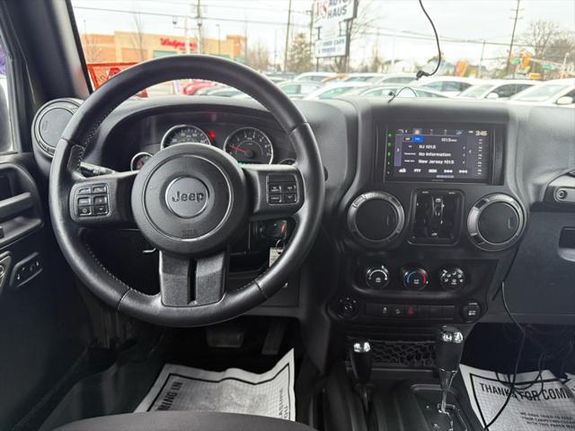 used 2015 Jeep Wrangler Unlimited car, priced at $16,495