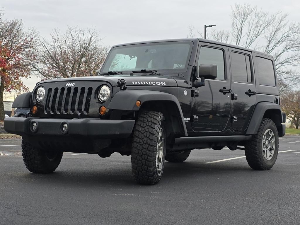 used 2013 Jeep Wrangler Unlimited car, priced at $18,977