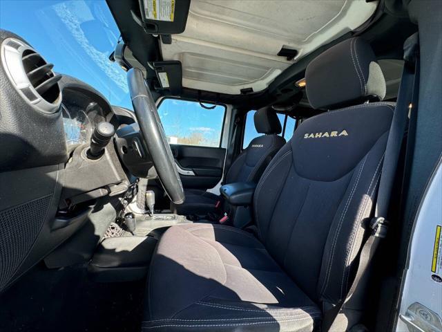 used 2014 Jeep Wrangler Unlimited car, priced at $13,975