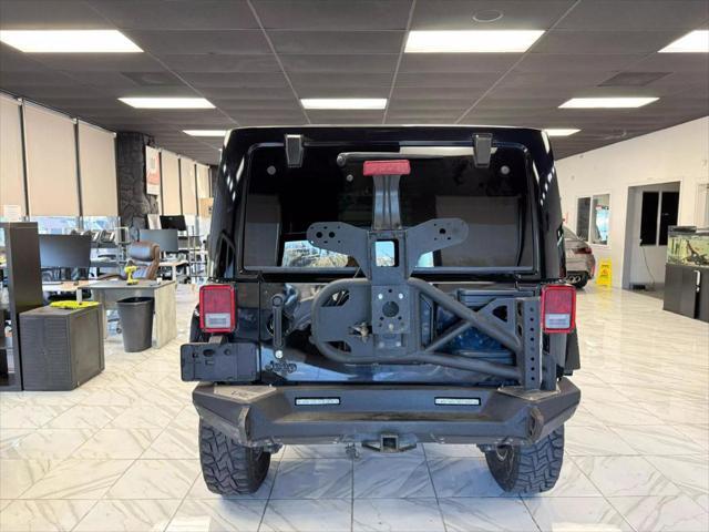 used 2014 Jeep Wrangler Unlimited car, priced at $18,497