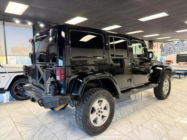 used 2014 Jeep Wrangler Unlimited car, priced at $18,497