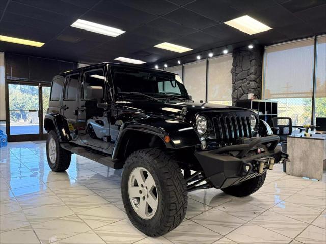 used 2014 Jeep Wrangler Unlimited car, priced at $18,497