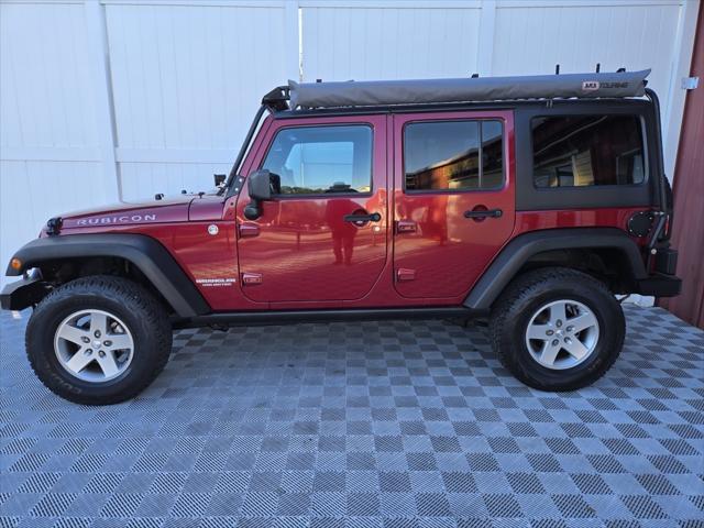 used 2011 Jeep Wrangler Unlimited car, priced at $22,150