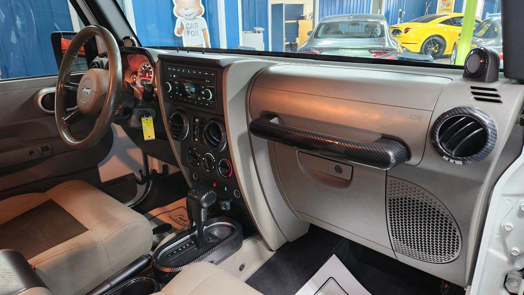 used 2010 Jeep Wrangler Unlimited car, priced at $10,875