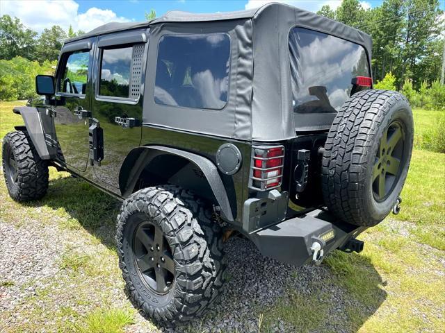 used 2014 Jeep Wrangler Unlimited car, priced at $17,675
