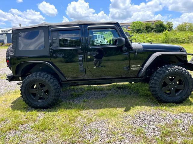 used 2014 Jeep Wrangler Unlimited car, priced at $17,675