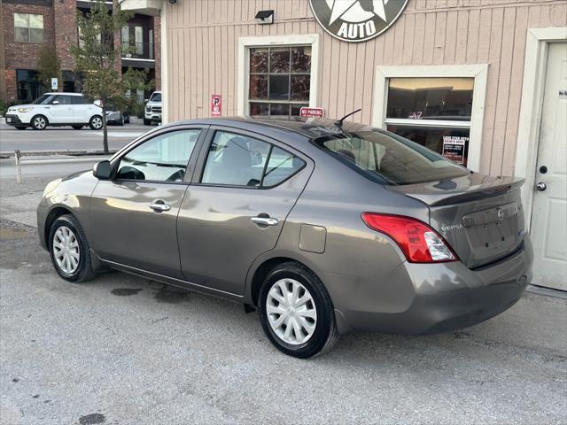 used 2013 Nissan Versa car, priced at $5,900