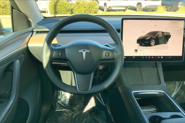 used 2024 Tesla Model Y car, priced at $32,956