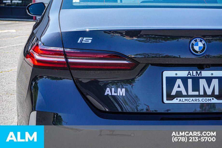 used 2024 BMW i5 car, priced at $53,920