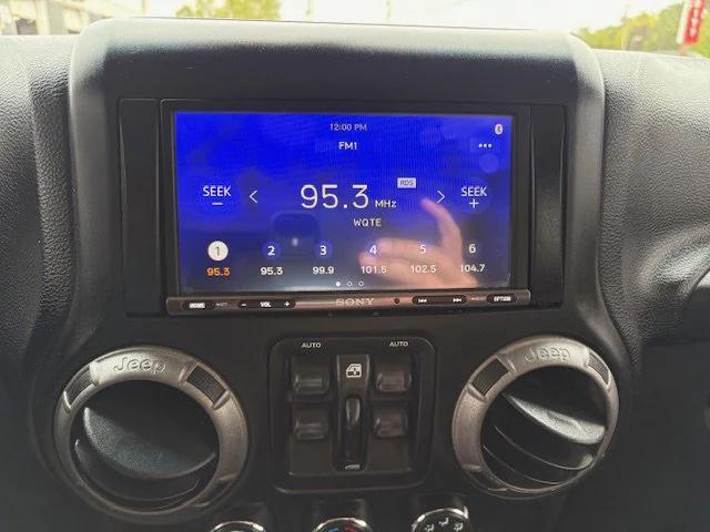 used 2014 Jeep Wrangler Unlimited car, priced at $15,900