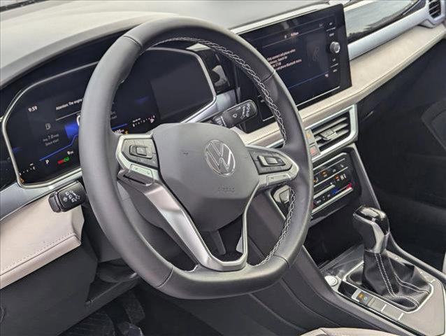 used 2025 Volkswagen Taos car, priced at $27,669
