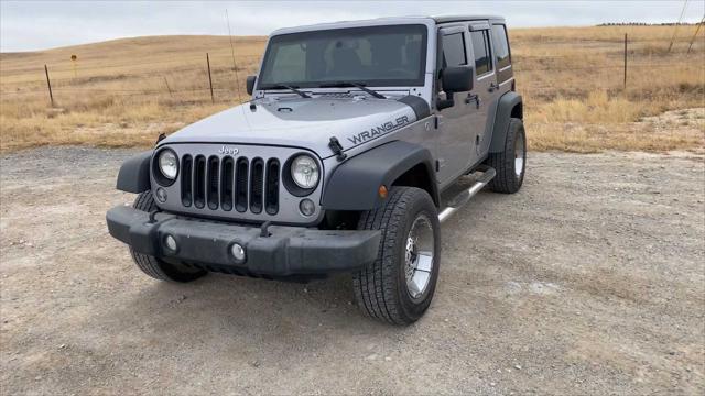 used 2014 Jeep Wrangler Unlimited car, priced at $17,907