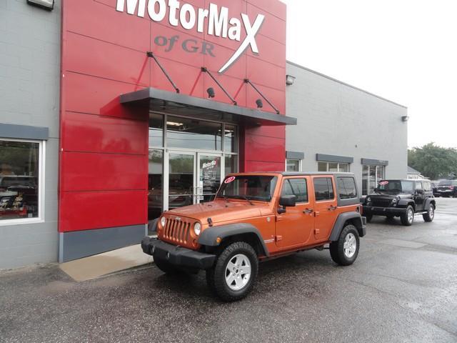 used 2011 Jeep Wrangler Unlimited car, priced at $12,455