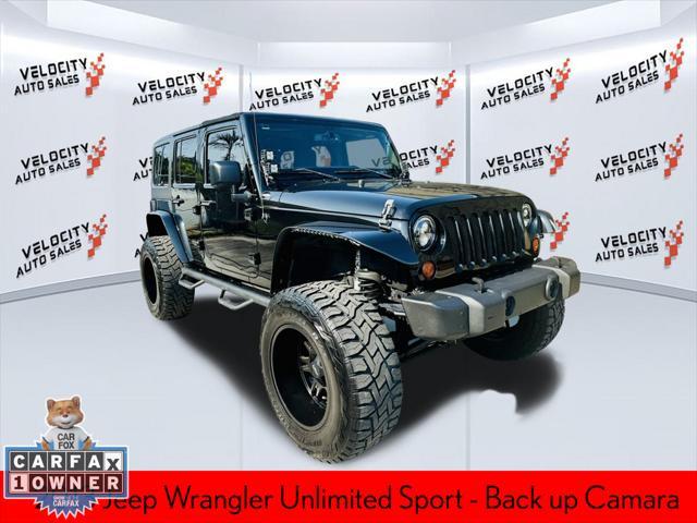 used 2013 Jeep Wrangler Unlimited car, priced at $17,990