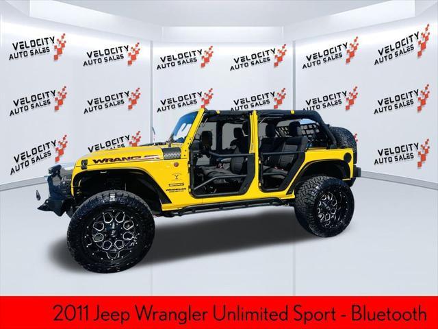 used 2011 Jeep Wrangler Unlimited car, priced at $16,990