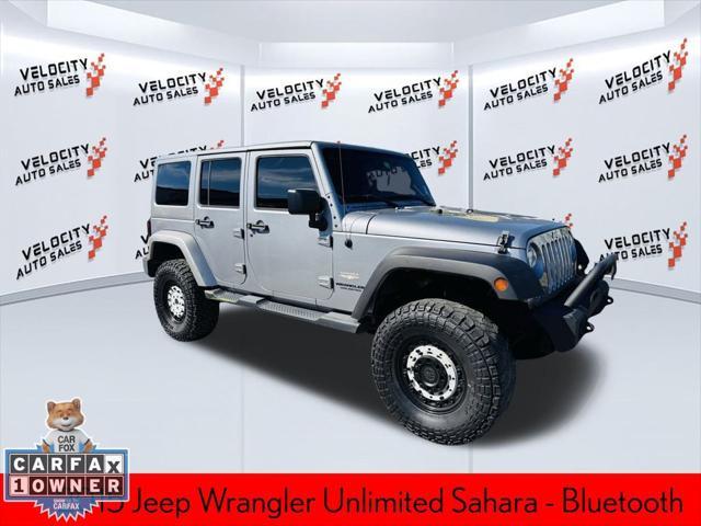 used 2015 Jeep Wrangler Unlimited car, priced at $16,990