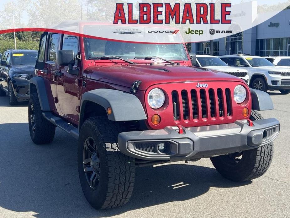 used 2013 Jeep Wrangler Unlimited car, priced at $13,277