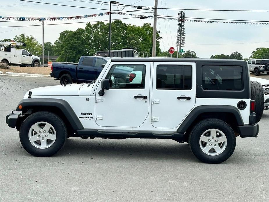 used 2015 Jeep Wrangler Unlimited car, priced at $15,277