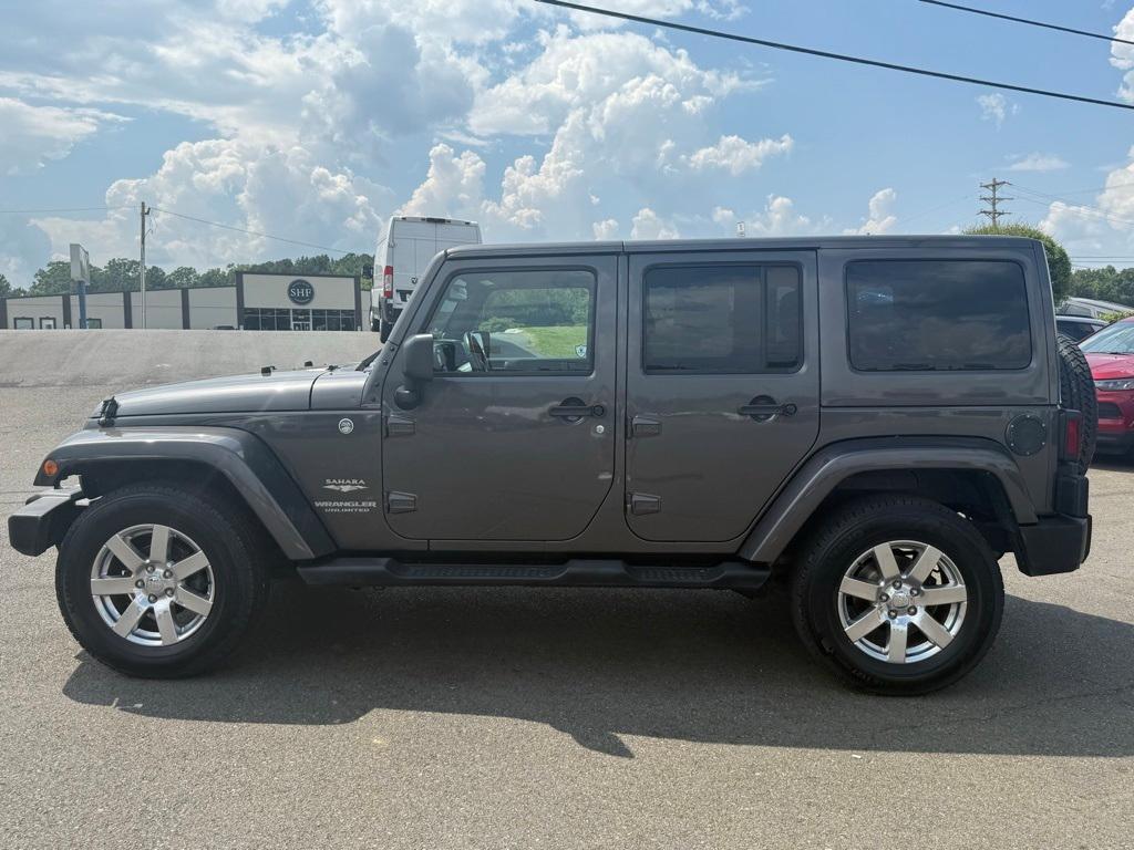 used 2014 Jeep Wrangler Unlimited car, priced at $16,277