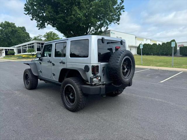 used 2014 Jeep Wrangler Unlimited car, priced at $16,890