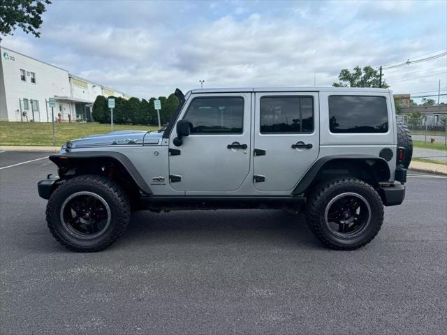 used 2014 Jeep Wrangler Unlimited car, priced at $16,890