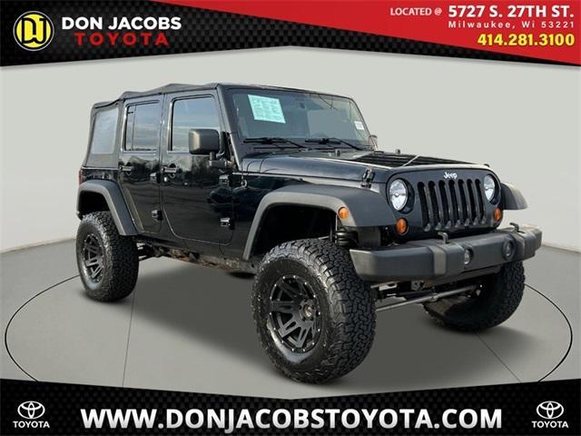 used 2011 Jeep Wrangler Unlimited car, priced at $12,499