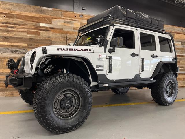 used 2015 Jeep Wrangler Unlimited car, priced at $29,106