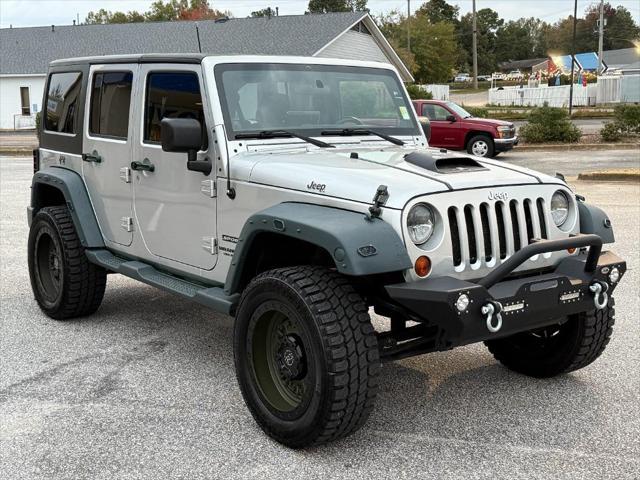 used 2011 Jeep Wrangler Unlimited car, priced at $16,995