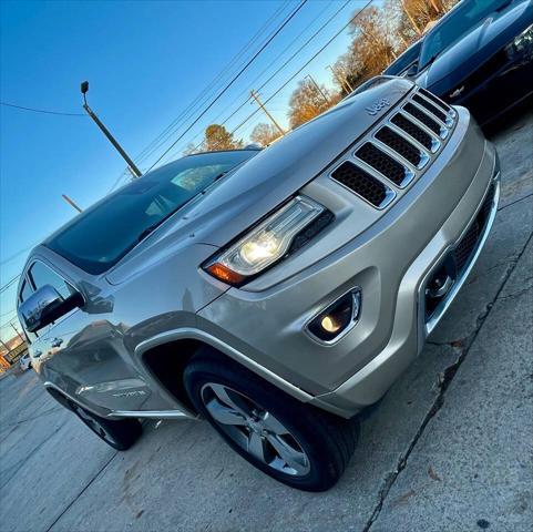 used 2014 Jeep Grand Cherokee car, priced at $14,498