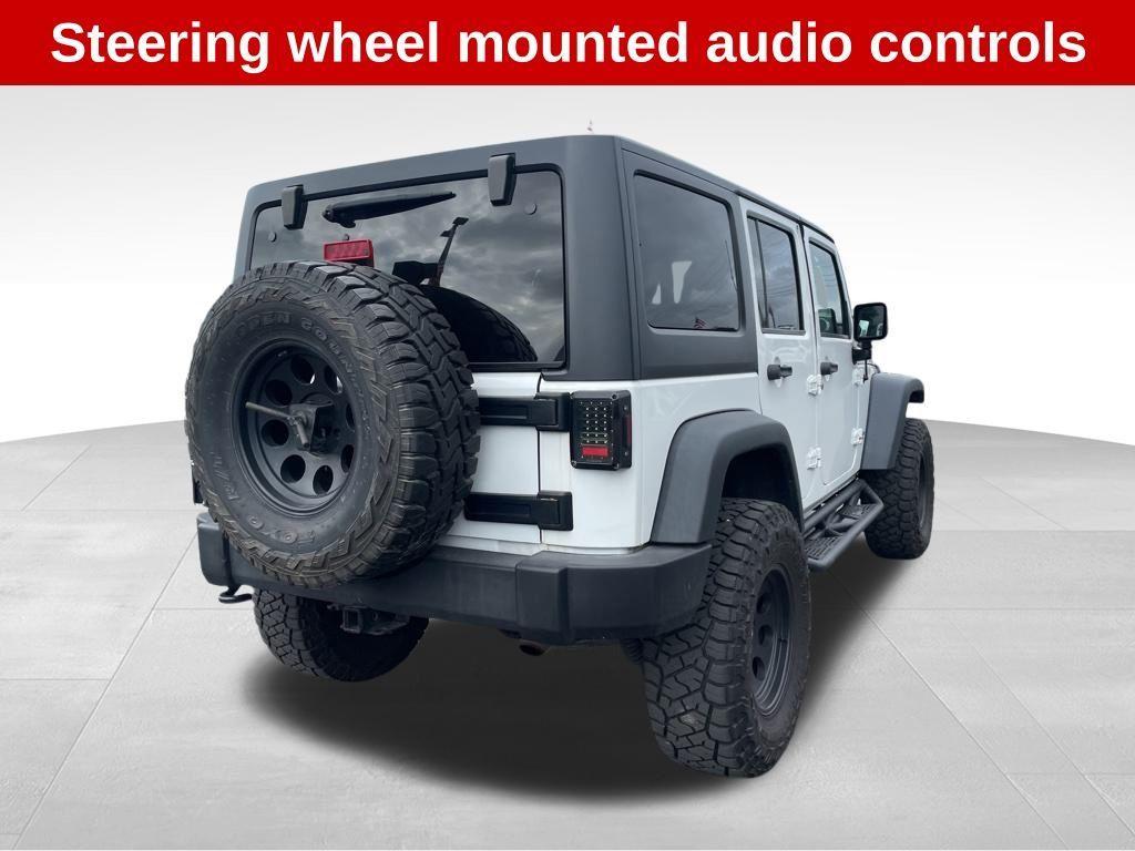 used 2016 Jeep Wrangler Unlimited car, priced at $18,540
