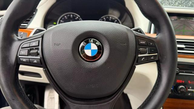 used 2015 BMW 750 car, priced at $14,950