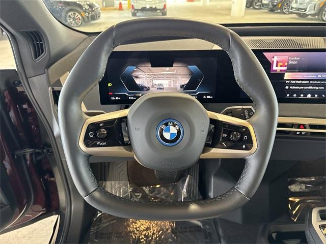 new 2024 BMW iX car, priced at $103,145