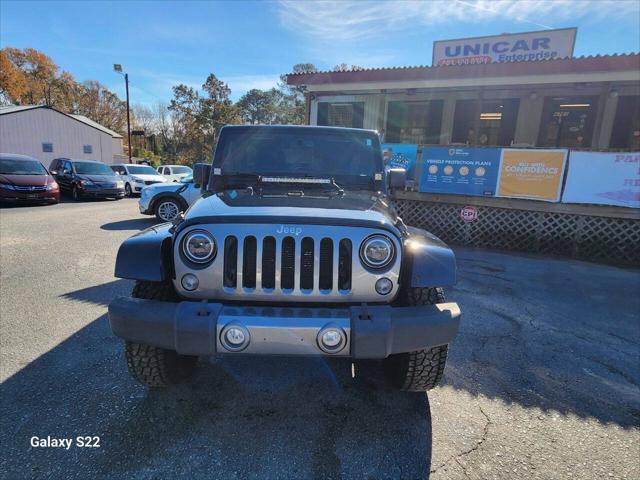 used 2014 Jeep Wrangler Unlimited car, priced at $17,975