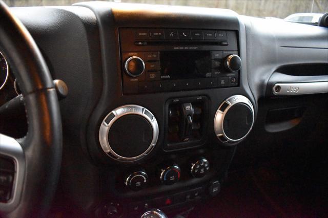 used 2013 Jeep Wrangler Unlimited car, priced at $15,799
