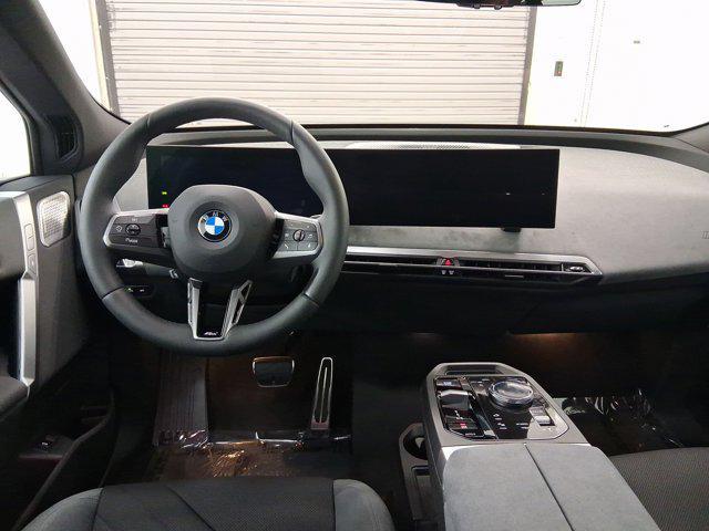 new 2026 BMW iX car, priced at $92,495