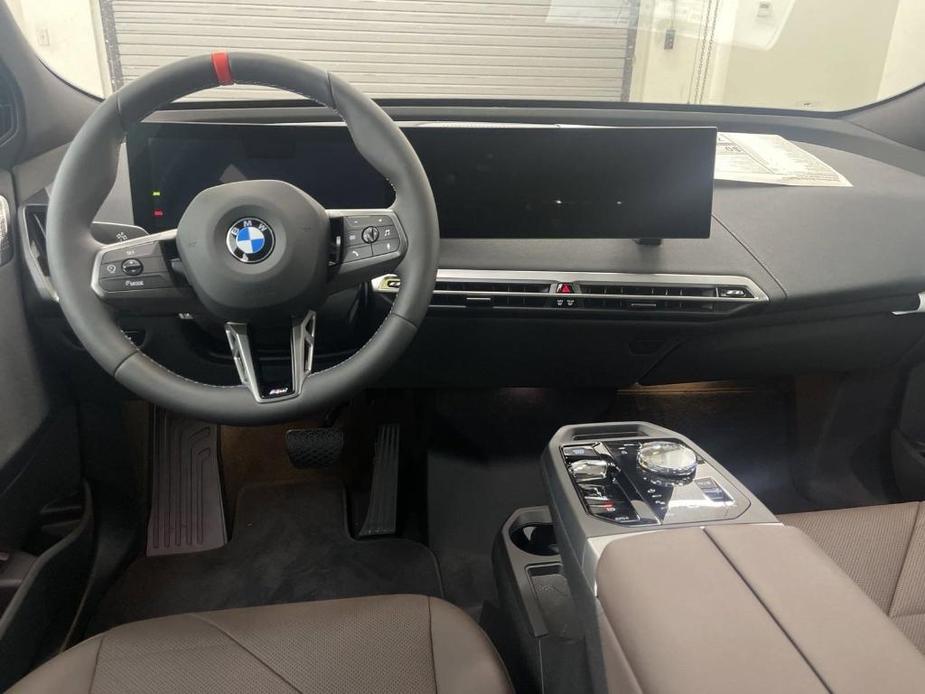 new 2025 BMW iX car, priced at $117,555