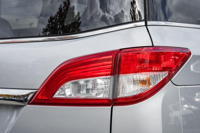 used 2012 Nissan Quest car, priced at $6,000